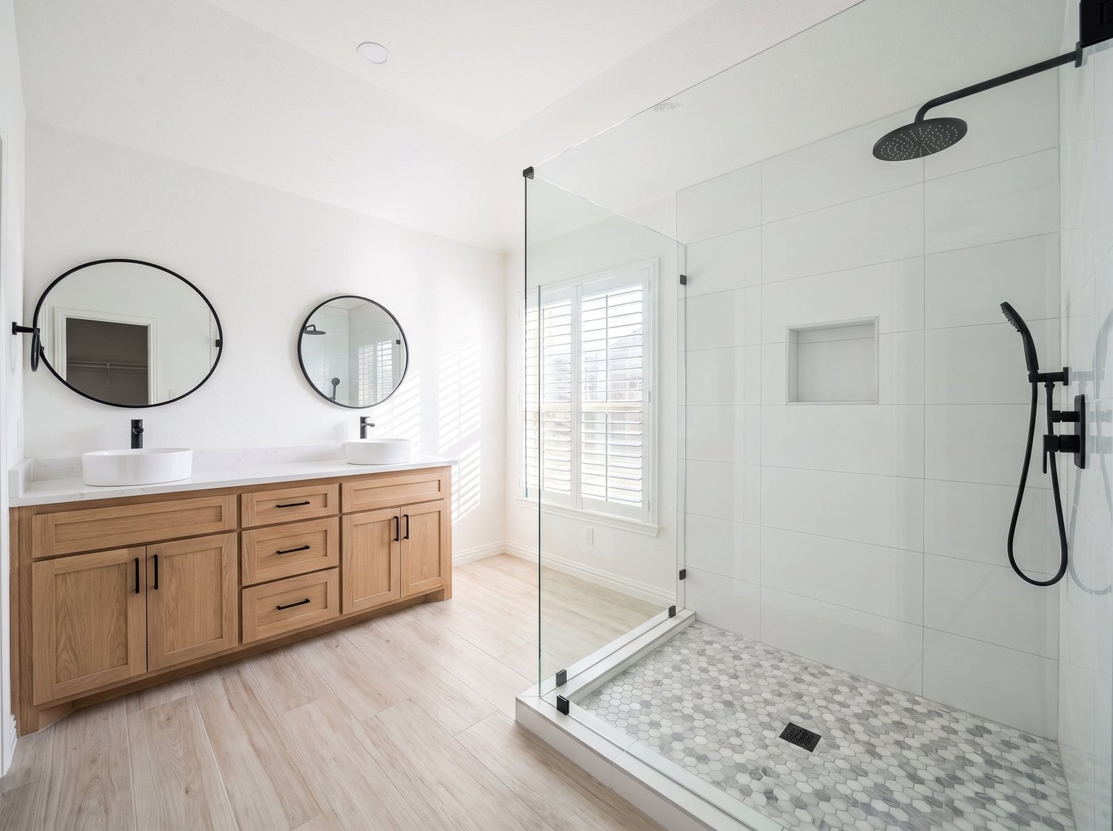 Full build: frameless glass, tiled niche, double vanity
