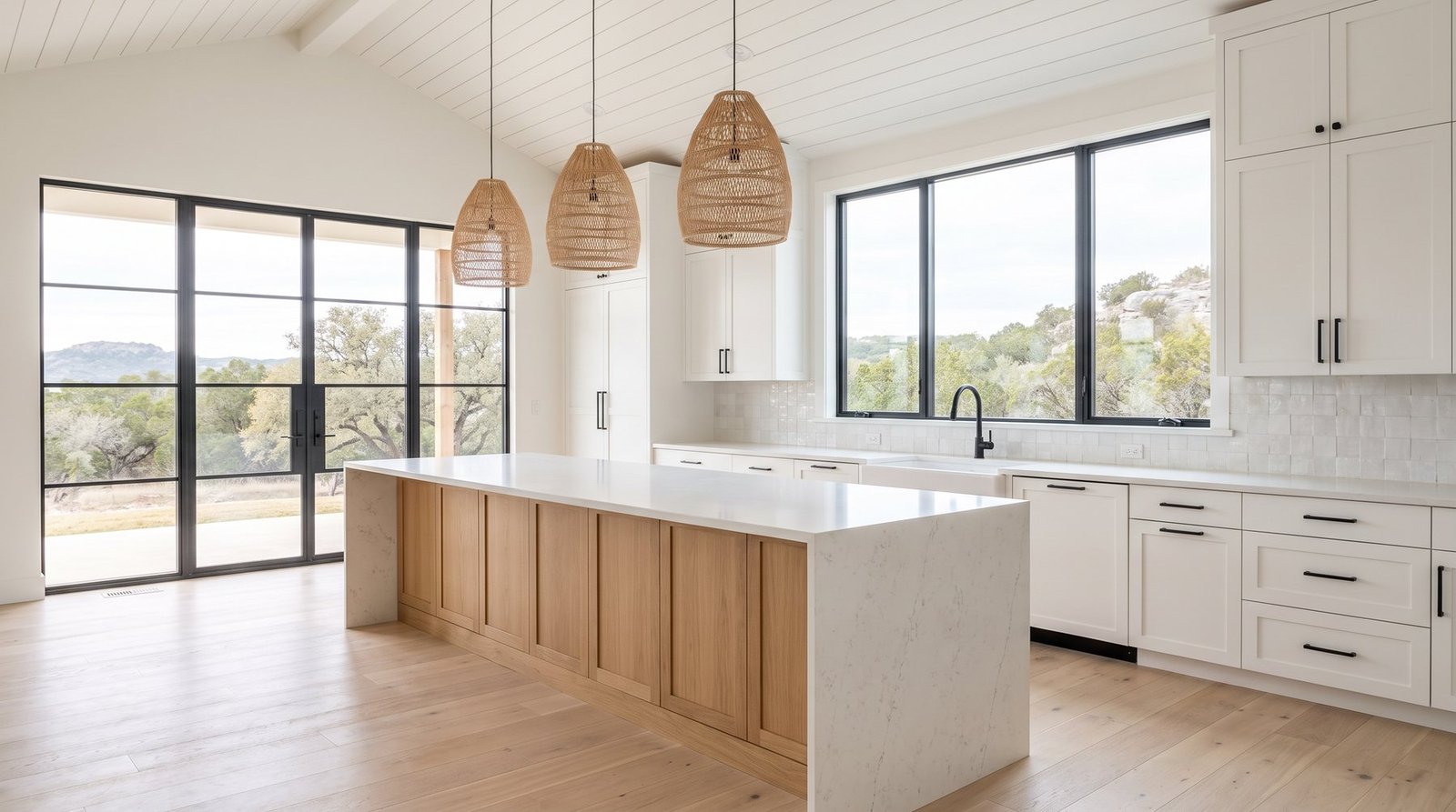 Bright Hill Country modern kitchen with white cabinetry, light oak island and quartz countertops